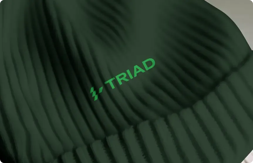 Green beanie with the Triad logo